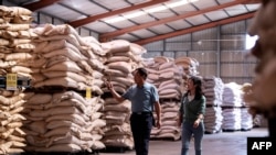 FILE - A Chinese pig farmer Sun Dawu is shown inside a feed warehouse in Hebei, outside Beijing, Sept. 24, 2019. 
