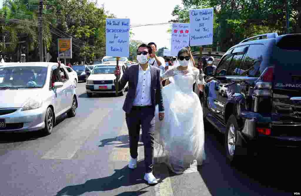 Protesters march on a street in Yangon, Myanmar, Feb. 9, 2021. (Credit: VOA Burmese Service)