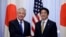 U.S. Defense Secretary Chuck Hagel (L) and Japan's Prime Minister Shinzo Abe shake hands before their meeting at the latter's former official residence in Tokyo, April 5, 2014. 