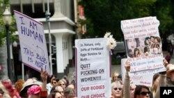 FILE - People rally in support of abortion rights at the Capitol in Sacramento, Calif., May 21, 2019.