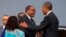 President Barack Obama, right, shakes hands with Ethiopian Prime Minister Hailemariam Desalegna after arriving at Addis Ababa Bole International Airport, on Sunday, July 26, 2015, in Addis Ababa. 