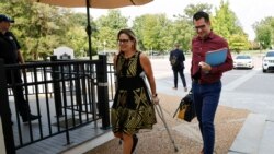FILE - U.S. Sen. Kyrsten Sinema, D-Ariz., arrives to deliver a speech on the U.S. Senate floor, Aug. 9, 2021.