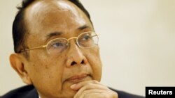 FILE - United Nations Special Rapporteur on the occupied Palestinian territories Makarim Wibisono pauses before his statement to the Human Rights Council at the European headquarters of the U.N. in Geneva March 23, 2015.