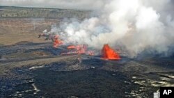 In this screen grab from webcam video provided by the U.S. Geological Survey, Kilauea, one of the most active volcanoes in the world, erupts in Hawaii, Sept. 10, 2023. 