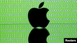 FILE - A 3-D printed Apple logo is seen in front of a displayed cyber code in this illustration taken Feb. 26, 2016. 