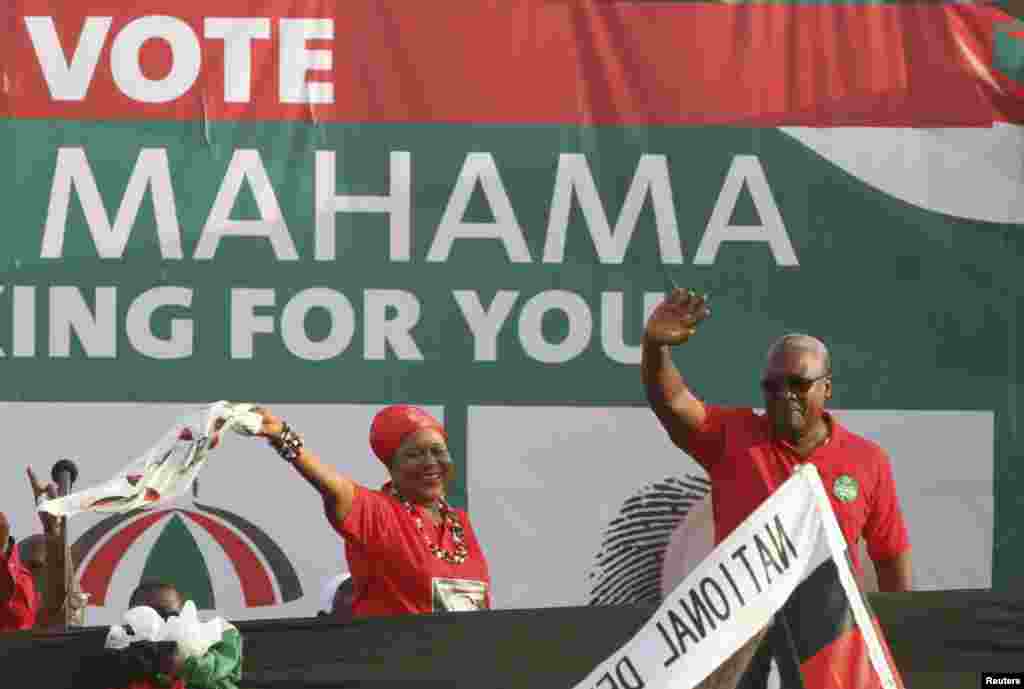 John Dramani Mahama (R), Ghana's interim president and National Democratic Congress (NDC) presidential candidate, waves during his last electoral rally, Accra, Ghana, December 5, 2012.