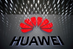 FILE PHOTO: A Huawei company logo at Shenzhen International Airport in Shenzhen, Guangdong province, China, July 22, 2019. REUTERS/Aly Song/File Photo