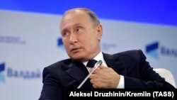 RUSSIA -- Russian President Vladimir Putin speaks during a session of the annual Valdai Discussion Club in Sochi, October 18, 2018