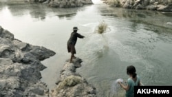 FILE - Fishing in the Mekong River below Khone Falls close to the Laos-Cambodian border. (Fletcher&Baylis/WWF- Greater Mekong)