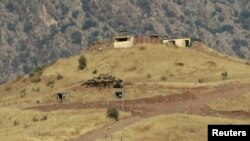 FILE - A tank is seen outside a Turkish military observation point in the mountains of the northern Iraqi region of Dohuk.