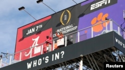 Clemson Tigers fan Nancy Volland and Alabama Crimson Tide supporter Llyas Ross Sr., who have been living on ESPN Billboard ahead of Monday's national championship game as part of an ESPN contest since December 26, 2018, are seen in this photo taken downto