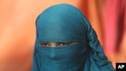 Fourteen-year-old Neha sits during an interview Nov. 11, 2020, in Karachi, Pakistan. Neha's family forced her to marry a 45-year-old Muslim man, who first made her convert from Christianity to Islam.