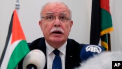 Palestinian Foreign Minister Riad Malki speaks during a press conference at the International Criminal Court, May 22, 2018. 