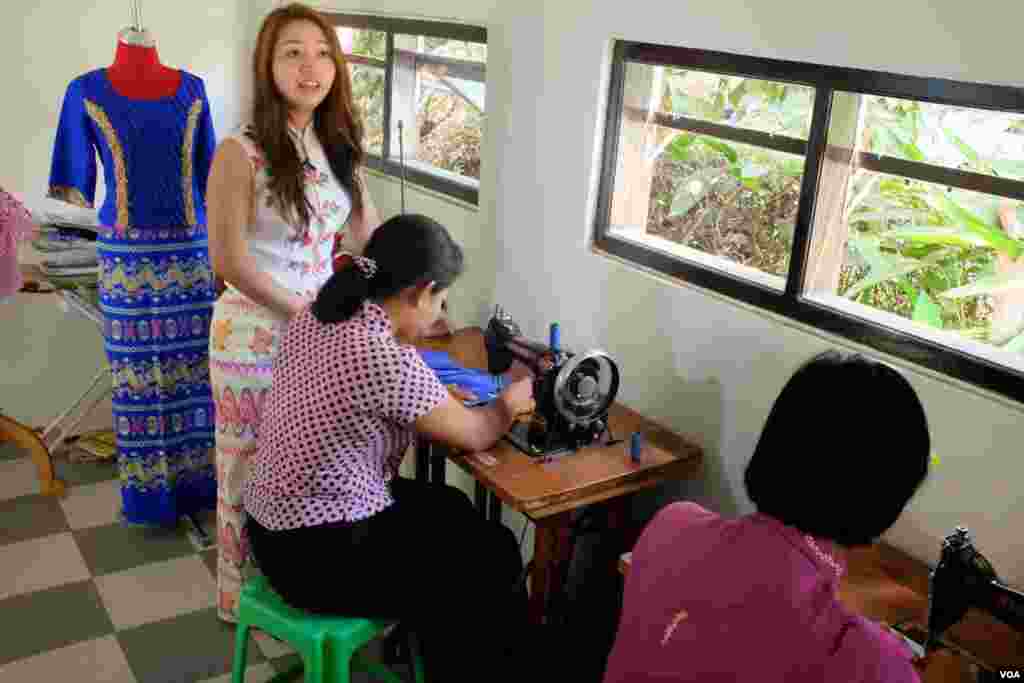 Designer May Myat Warso in her Happy Heart Fashion House. (Steve Herman/VOA News)