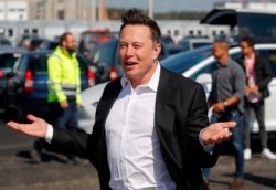 FILE - In this Sept. 3, 2020, photo, Tesla CEO Elon Musk arrives to visit the construction site of the future US electric car giant Tesla in Gruenheide near Berlin.