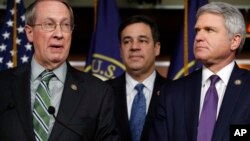 House Judiciary Committee Chairman Rep. Bob Goodlatte, R-Va., left, speaks next to Rep. Raul Labrador, R-Idaho, and Rep. Michael McCaul, R-Texas, Jan. 10, 2018, on Capitol Hill in Washington. 