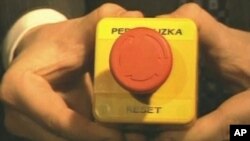 Russian Foreign Minister Sergei Lavrov holds a "reset" button given to him by Secretary of State Hillary Clinton