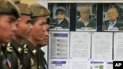 Lightning can be seen as a large storm front crosses over the Sydney, Australia, suburb of Wakehurst. A severe thunderstorm hit parts of Sydney Friday afternoon and damaged more than 100 properties.