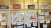 Anti-Trump messages are seen posted on window panels outside the GOP Badgers' room at the Student Activities Center on campus at the University of Wisconsin-Madison. (J. Kiah)
