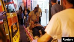 Israeli medics evacuate a man wounded in what police suspected was a Palestinian stabbing attack to Barzilai hospital in Ashkelon, Nov. 21, 2015.