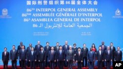 Chinese President Xi Jinping stands with Secretary General Interpol Jurgen Stock, center, right, and Meng Hongwei, center left, president of Interpol, pose for a group photo at the 86th Interpol General Assembly at Beijing National Convention Center, Tuesday, Sept. 26, 2017, in Beijing, China.