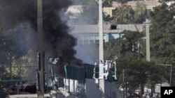 Smoke billows during an attack on offices belonging to the British Council in Kabul, Afghanistan, Aug. 19, 2011.