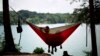People sitting in a hammock in Laurel Park, Gainesville, Georgia, June 8, 2015.