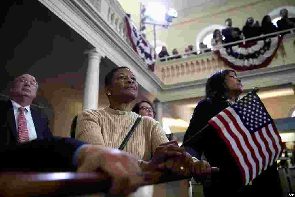 Supporters look on as democratic presidential candidate former Secretary of State Hillary Clinton speaks during a "Get Out The Vote" event at the Old South Meeting Hall in Boston, Massachusetts, Feb. 29, 2016. 