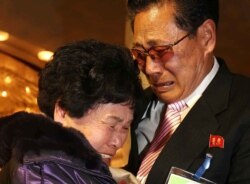 FILE - Lee Son-hyang, 88, left, of South Korea and Lee Yoon Geun, 72, of North Korea embrace during a reunion event for families divided by the two countries, at the Diamond Mountain resort in North Korea, Feb. 20, 2014.