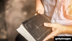 A man reading the Holy Bible.