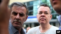 FILE - Andrew Craig Brunson (left), an evangelical pastor from Black Mountain, North Carolina, arrives at his house in Izmir, Turkey, July 25, 2018.
