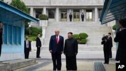President Donald Trump and North Korean leader Kim Jong Un stand on the North Korean side in the Demilitarized Zone, Sunday, June 30, 2019 at Panmunjom. (AP Photo/Susan Walsh)