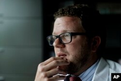 Dr. Dan Lonergan, a pain specialist who also focuses on addiction, sits in his office in Franklin, Tennessee, June 5, 2017. Lonergan faced his own dark abyss years ago when his older brother died suddenly of a possible opioid overdose.