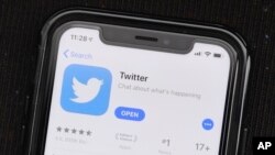 FILE - The social media application, Twitter is displayed on Apple's App Store.