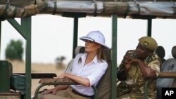 FILE - First lady Melania Trump looks out over Nairobi National Park in Nairobi, Kenya, Oct. 5, 2018, during a safari guided by Nelly Palmeris.