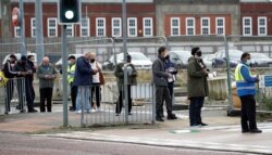 People queue to take a COVID-19 test at a walk-in test facility in Bolton, Britain, Sept. 7, 2020.