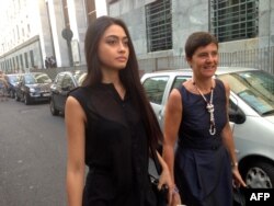 FILE - Italian beauty queen Ambra Battilana, pictured in Milan in July 2013, says she felt pressured to sign a nondisclosure agreement after having accused media mogul Harvey Weinstein of groping her in 2015.