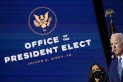 U.S. President-elect Joe Biden and Vice President-elect Kamala Harris face reporters after meeting with members of their coronavirus disease "Transition COVID-19 Advisory Board" in Wilmington, Delaware, Nov. 9, 2020.
