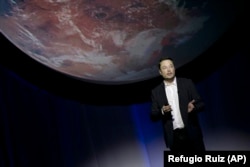 In this Sept. 27, 2016 file photo, SpaceX founder Elon Musk speaks during the 67th International Astronautical Congress in Guadalajara, Mexico.