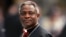 Cardinal Peter Kodwo Appiah Turkson of Ghana arrives to attend a mass led by bishop Leonardo Sandri of Argentina in St. Peter's Basilica at the Vatican April 13, 2005.
