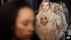 Somali-American model Halima Aden wears a creation part of the Max Mara women's Fall-Winter 2017-18 collection, that was presented in Milan, Italy, Feb. 23, 2017.