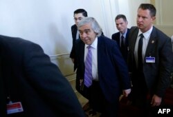FILE - Then-U.S. Secretary of Energy Ernest Moniz, center, arrives at a meeting in Vienna, Austria, July 9, 2015.