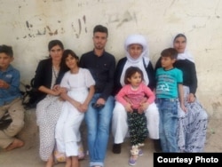 Dawood Saleh, a Yazidi from Sinjar who has resettled in the U.S., is pictured with his family in Sinjar before the Islamic State attack in 2014.
