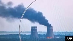 This video grab taken from a handout footage released by the Ukrainian Presidential Press Service on Aug. 11, 2024, shows a fire at a cooling tower of the Russian-controlled Zaporizhzhia nuclear power plant in Energodar, Southern Ukraine.