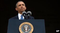 President Barack Obama pauses while speaking at a ceremony in Washington, Aug. 28, 2013. 
