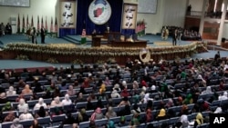 Afghan President Hamid Karzai speaks during the first day of the Loya Jirga in Kabul, Nov. 21, 2013.