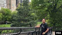 Jakkrit Yompayorm flashes a smile in New York City's Central Park. (Photo by Janine Phakdeetham)
