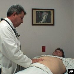 Professional actor Tom Wyatt acts the role of patient with Kurt Haspert, a nurse practitioner student.