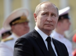 FILE - Russian President Vladimir Putin attends the Navy Day parade in Saint Petersburg, Russia, July 28, 2019.