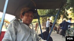 Indonesian villager Mama Hasria swims upstream with about 200 empty jerry cans tied to her back, a daily trip she and other local women make to get clean water for their community on Sulawesi island.